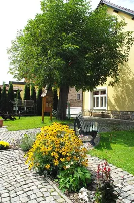 Ein Garten an der Unterkunft Landhotel Heidekrug