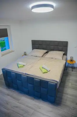 Ein Bett oder Betten in einem Zimmer der Unterkunft Ferienwohnung Papststeinblick