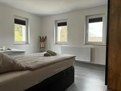 Ein Bett oder Betten in einem Zimmer der Unterkunft Ferienwohnung Papststeinblick