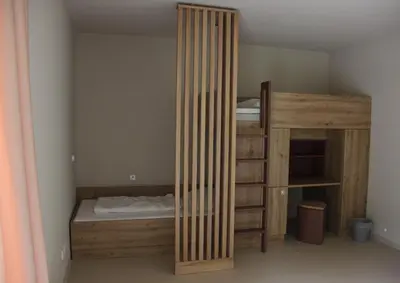 Ein Bett oder Betten in einem Zimmer der Unterkunft Forum Grillensee