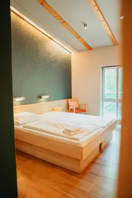 Ein Bett oder Betten in einem Zimmer der Unterkunft Forum Grillensee