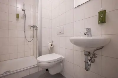 Ein Badezimmer in der Unterkunft T21 - Apartment direkt im Zentrum mit Parkplatz