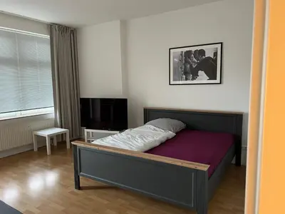 Ein Bett oder Betten in einem Zimmer der Unterkunft Ferienwohnung für kleine und große Reisegruppe