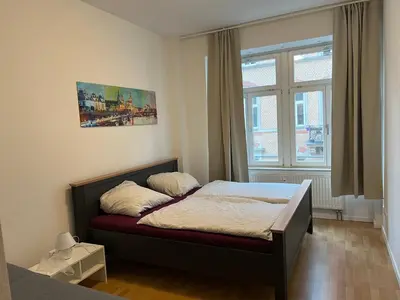 Ein Bett oder Betten in einem Zimmer der Unterkunft Ferienwohnung für kleine und große Reisegruppe