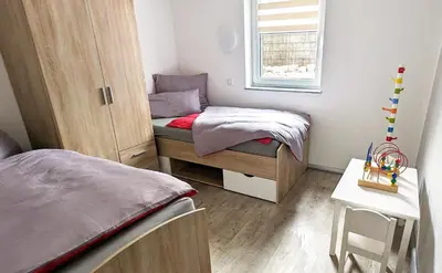 Ein Bett oder Betten in einem Zimmer der Unterkunft Haus Kleiner Findling im Lausitzer Seenland