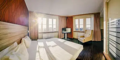 Ein Bett oder Betten in einem Zimmer der Unterkunft Star G Hotel Premium Dresden Altmarkt