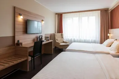 Ein Bett oder Betten in einem Zimmer der Unterkunft Star G Hotel Premium Dresden Altmarkt