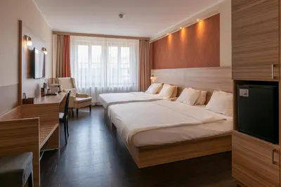 Ein Bett oder Betten in einem Zimmer der Unterkunft Star G Hotel Premium Dresden Altmarkt