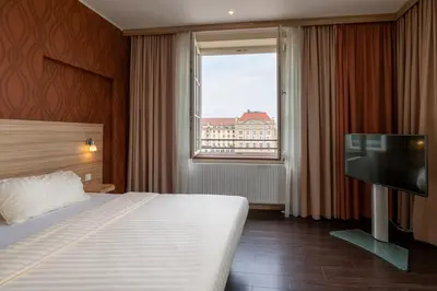 Ein Bett oder Betten in einem Zimmer der Unterkunft Star G Hotel Premium Dresden Altmarkt