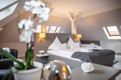 Ein Bett oder Betten in einem Zimmer der Unterkunft Hotel 