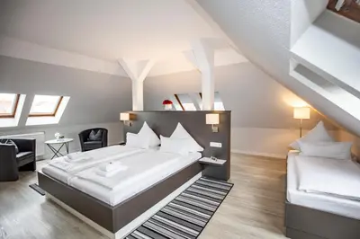 Ein Bett oder Betten in einem Zimmer der Unterkunft Hotel 