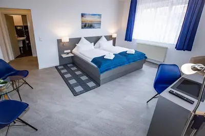 Ein Bett oder Betten in einem Zimmer der Unterkunft Hotel 