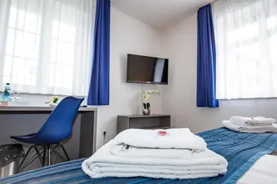 Ein Bett oder Betten in einem Zimmer der Unterkunft Hotel 