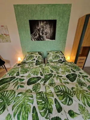 Ein Bett oder Betten in einem Zimmer der Unterkunft Pension Weitblick