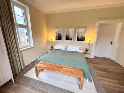 Ein Bett oder Betten in einem Zimmer der Unterkunft Gemütliches Refugium am Bahnhof - Perfekt zum erkunden der Sächsischen Schweiz