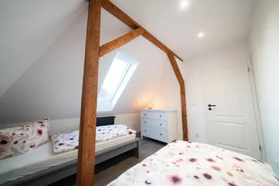 Ein Bett oder Betten in einem Zimmer der Unterkunft Ferienwohnung am Großen Garten Dresden