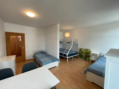 Ein Bett oder Betten in einem Zimmer der Unterkunft Wohnglück Dresden
