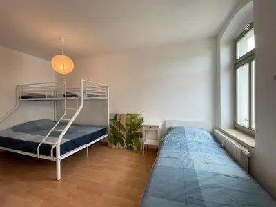 Ein Bett oder Betten in einem Zimmer der Unterkunft Wohnglück Dresden