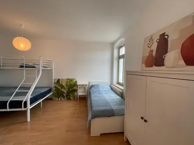 Ein Bett oder Betten in einem Zimmer der Unterkunft Wohnglück Dresden