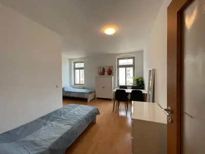Ein Bett oder Betten in einem Zimmer der Unterkunft Wohnglück Dresden
