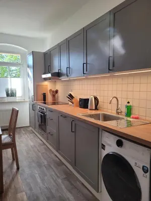 Küche/Küchenzeile in der Unterkunft Apartment Leuben - Stylisch - Balkon - Küche