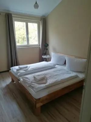 Ein Bett oder Betten in einem Zimmer der Unterkunft Ferienwohnungen Krügerstraße