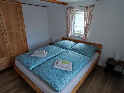Ein Bett oder Betten in einem Zimmer der Unterkunft Ferienwohnungen Urlaubsglück