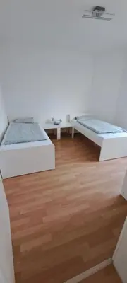 Ein Bett oder Betten in einem Zimmer der Unterkunft Moderne Monteurswohnung in Chemnitz