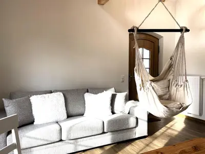 Ein Sitzbereich in der Unterkunft Ferienhäuser KRABAT-Mühle Schwarzkollm