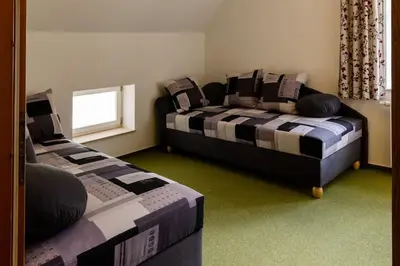 Ein Bett oder Betten in einem Zimmer der Unterkunft Ferienwohnung SandSteinLand