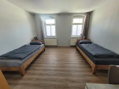 Ein Bett oder Betten in einem Zimmer der Unterkunft Monteurswohnung Roßwein - Zentral - Küche