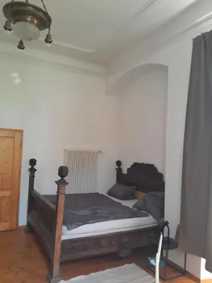 Ein Bett oder Betten in einem Zimmer der Unterkunft Residieren im barocken Herrenhaus Pannewitz