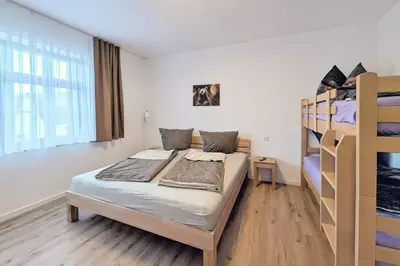 Ein Bett oder Betten in einem Zimmer der Unterkunft Ferienquartier Forsthaus 2