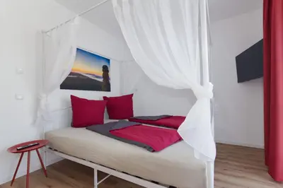 Ein Bett oder Betten in einem Zimmer der Unterkunft Ferienquartier Forsthaus 2
