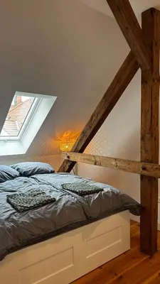 Ein Bett oder Betten in einem Zimmer der Unterkunft Ruhige-Moderne Wohnung mit Burgblick