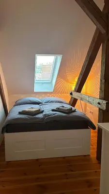 Ein Bett oder Betten in einem Zimmer der Unterkunft Ruhige-Moderne Wohnung mit Burgblick