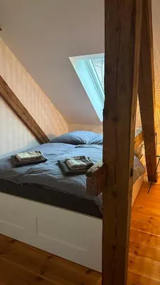 Ein Bett oder Betten in einem Zimmer der Unterkunft Ruhige-Moderne Wohnung mit Burgblick