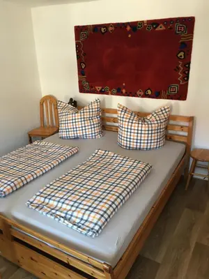 Ein Bett oder Betten in einem Zimmer der Unterkunft Ferienwohnung in Meißen-Triebischtal