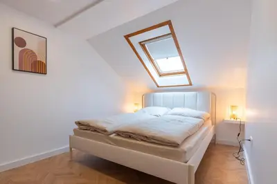 Ein Bett oder Betten in einem Zimmer der Unterkunft Moderne City Appartments