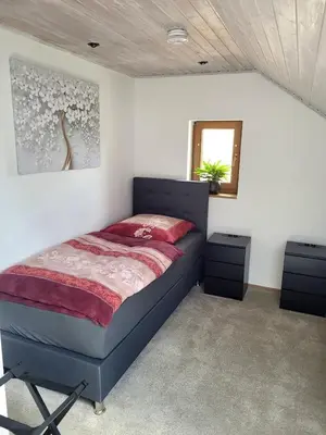 Ein Bett oder Betten in einem Zimmer der Unterkunft 75qm Apartment