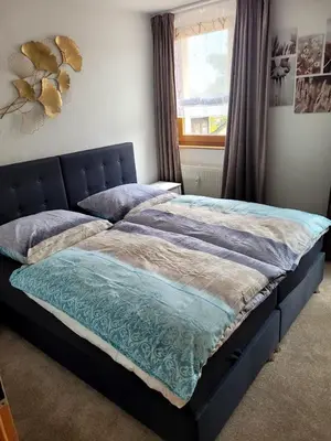 Ein Bett oder Betten in einem Zimmer der Unterkunft 75qm Apartment