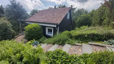 Ein Garten an der Unterkunft Ferienhaus zur Dorfbachklamm
