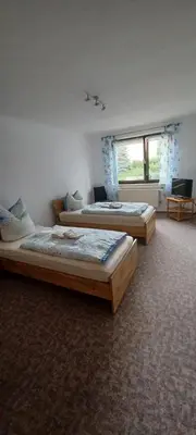 Ein Bett oder Betten in einem Zimmer der Unterkunft Ferienwohnung am Rittergut