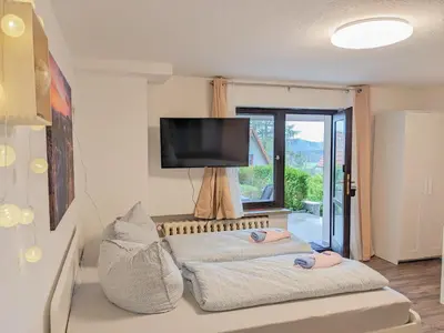 Ein Bett oder Betten in einem Zimmer der Unterkunft B2 - Urlaubsmagie - mit Terrasse& Grill direkt am Wanderweg