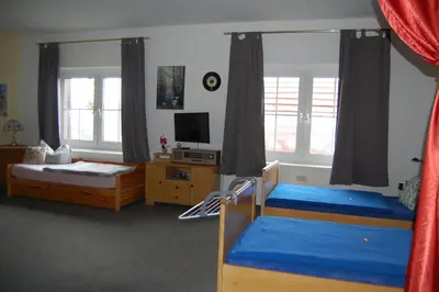 Ein Bett oder Betten in einem Zimmer der Unterkunft Ferienwohnung Sunwood