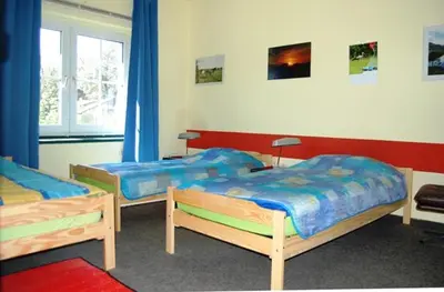 Ein Bett oder Betten in einem Zimmer der Unterkunft Ferienwohnung Sunwood