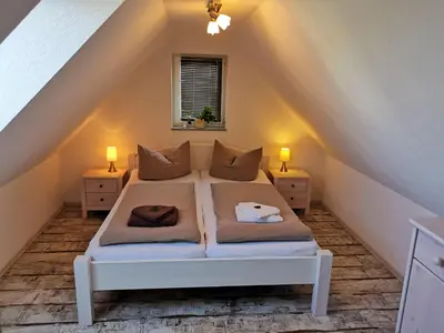 Ein Bett oder Betten in einem Zimmer der Unterkunft Ferienhaus Papstdorf Sächsische Schweiz 15