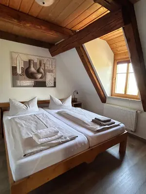Ein Bett oder Betten in einem Zimmer der Unterkunft Ferienwohnung Gesindestube Bauernhaus Vetter