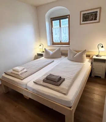 Ein Bett oder Betten in einem Zimmer der Unterkunft Ferienwohnung Kutscherstuben Bauernhaus Vetter