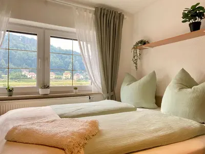 Ein Bett oder Betten in einem Zimmer der Unterkunft Ferienwohnung Elbstübchen